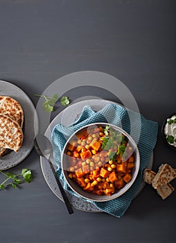 Sweet potato and chickpea curry with naan bread