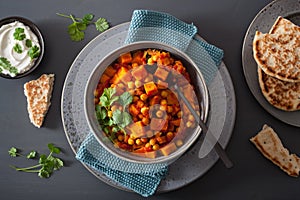 Sweet potato and chickpea curry with naan bread