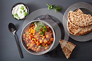 Sweet potato and chickpea curry with naan bread