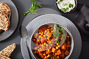 Sweet potato and chickpea curry with naan bread