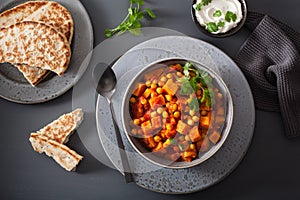 Sweet potato and chickpea curry with naan bread