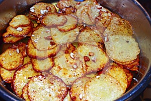Sweet potato food dish, potato fritters being cooked in a vending stall