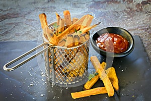 Sweet Potato Fries in Metal Basket with Ketchup