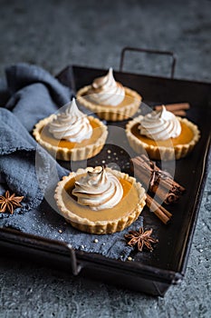 Sweet potato tartlets with torched Swiss meringue