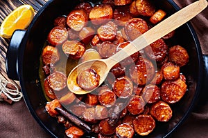 Sweet potatoes in a black ceramic dish