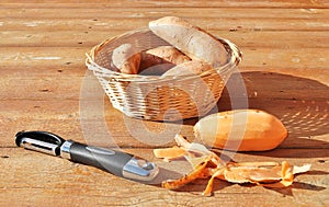 Sweet potatoes and peeler.