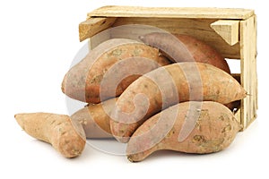 Sweet potatoes in a wooden crate