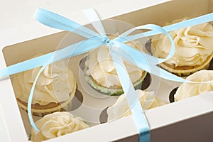 Sweet present. gift box with cupcakes