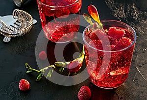 Sweet raspberry vodka cocktail with ice. Refreshing summer drink