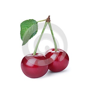 Sweet red juicy cherries with leaf isolated