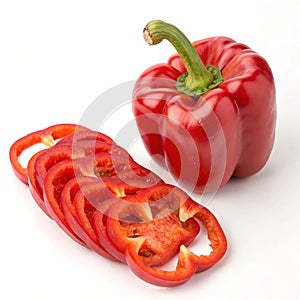 Sweet red pepper whole and sliced isolated on white photo