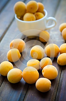 Sweet ripe apricots on wooden table. Selective focus