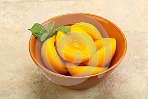 Sweet ripe canned peaches with mint