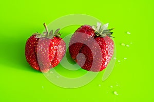 Red ripe berry of strawberry on green Matt background