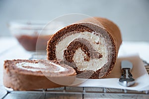 Sweet roll with wiped cream, delicious chocolate cake