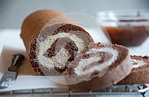 Sweet roll with wiped cream, delicious chocolate cake