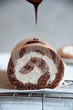 Sweet roll with wiped cream, delicious chocolate cake