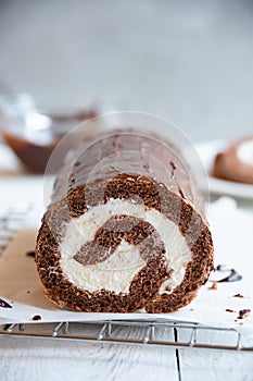 Sweet roll with wiped cream, delicious chocolate cake