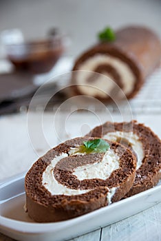 Sweet roll with wiped cream, delicious chocolate cake