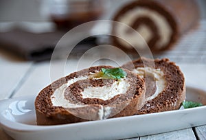 Sweet roll with wiped cream, delicious chocolate cake