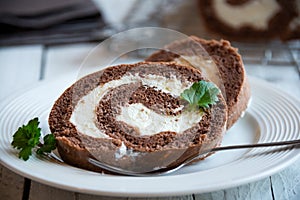 Sweet roll with wiped cream, delicious chocolate cake