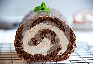 Sweet roll with wiped cream, delicious chocolate cake