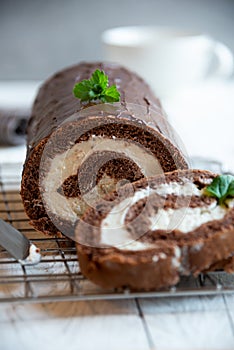 Sweet roll with wiped cream, delicious chocolate cake