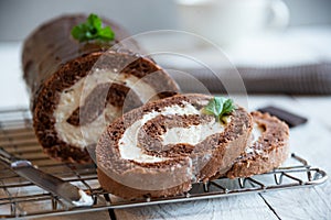 Sweet roll with wiped cream, delicious chocolate cake