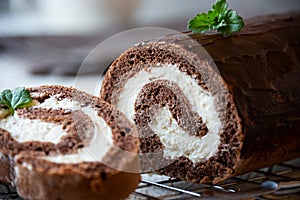 Sweet roll with wiped cream, delicious chocolate cake