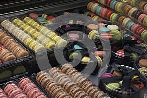 sweet round colored cookies in bakery vitrine