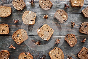 Sweet rye bread slices on wooden table, flat lay