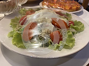 sweet salad in white plate on the table for breakfast