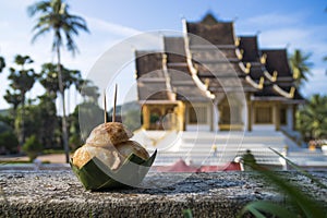 Sweet and Savory Grilled Coconut-Rice Hotcakes, Coconut Rice Cake on banana packaging, Asian dessert, Thai, Thailand, Luang photo