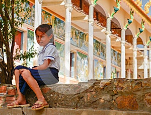 Sweet School Girl in Uniform Ouside Temple in Rural Cambodia