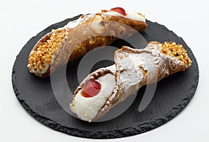 Sweet Sicilian cannoli filled with ricotta cream. Traditional Sicilian Italian dessert