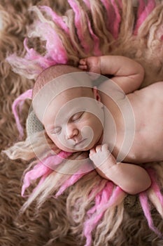 Sweet sleeping newborn baby on gentle background