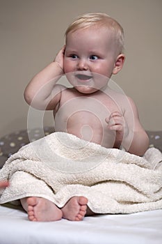 Sweet small baby with towel