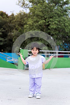 Sweet smiling child girl wearing white uniform. Summer travel. Empty space for enter text. Kid age 3 years old. Vertical imaged