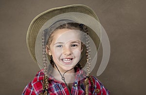 Sweet smiling girl in cowboy hat