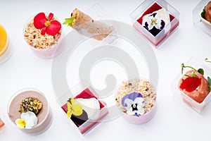 Sweet snacks in clear glasses for events. Catering.