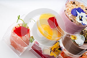 Sweet snacks in clear glasses for events. Catering.