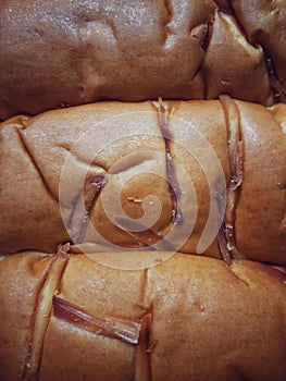 Sweet and soft bread topped with grated cheese and soft cheese filling