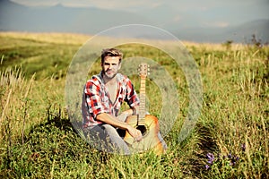 Sweet song. western camping and hiking. sexy man with guitar in checkered shirt. country music song. cowboy man with