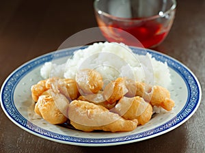 Sweet and sour chicken with dipping sauce.