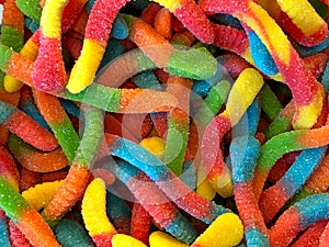 Sweet and sour gummy worms close up photo