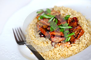 Sweet and sour tofu with quinoa and scallions