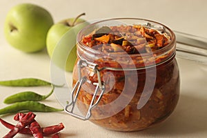 Sweet and spicy Pickled Green apple or achar made with finely sliced green apple preserved in brine, vinegar, edible oil along