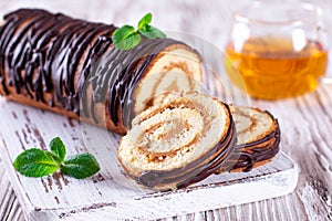 Sweet sponge roll stuffed with cream