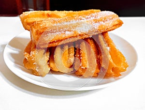 sweet sugared churros, traditional Argentine fried dough pastry