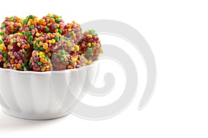 Sweet and Tangy Candy with Small Candies on the Outside of a Chewy Center Isolated on a White Background